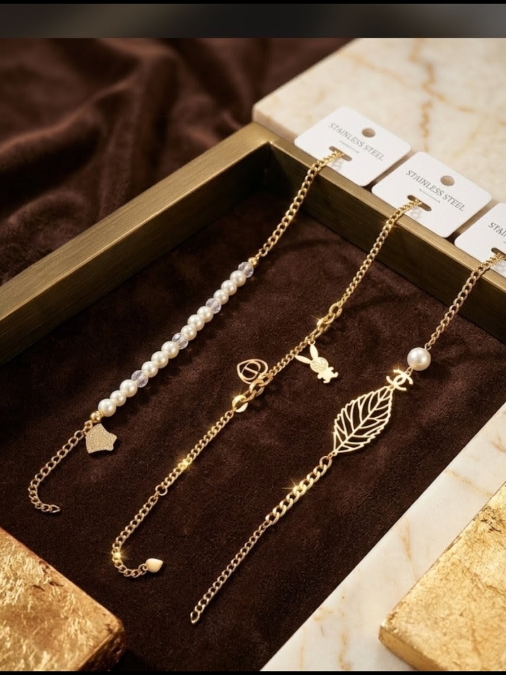 Three Gold Pearl Leaf & Charm Bracelets